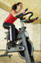 Woman Riding an Exercise Bike thumbnail