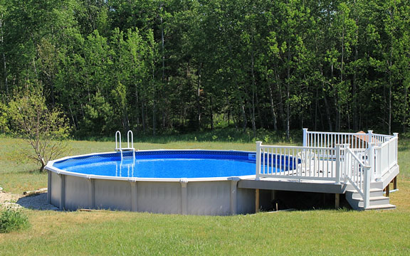 backyard swimming pool with deck