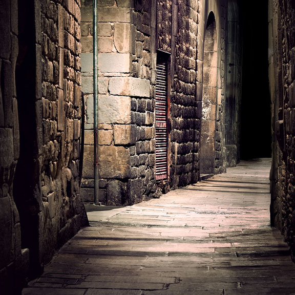 alley between stone buildings