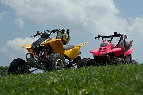 red atv and yellow atv