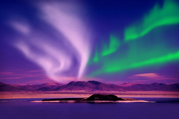 colorful aurora at night over a lake