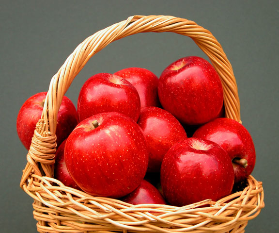 wicker basket full of red apples