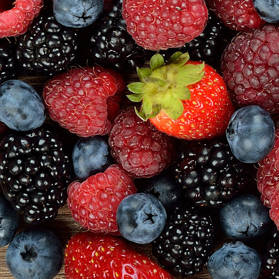 blackberries, blueberries, raspberries, and a strawberry