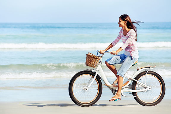 bicycling along a beach