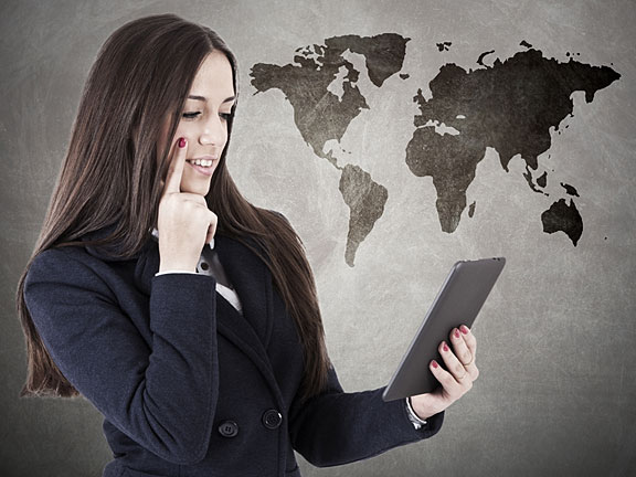 world map and businesswoman with smartphone