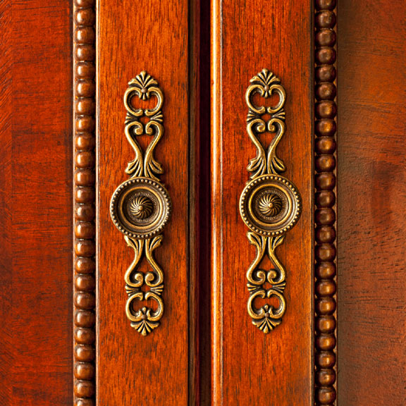 ornate knobs on wood cabinet doors