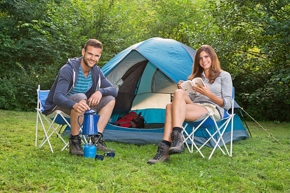 young couple with camping tent