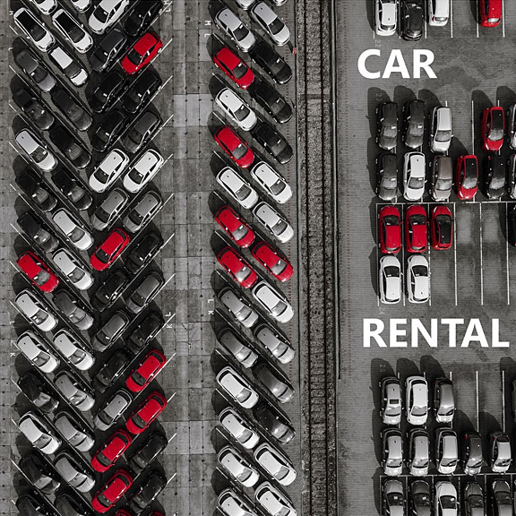 car rental lot with many rental cars