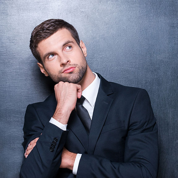 man resting his chin on his fist