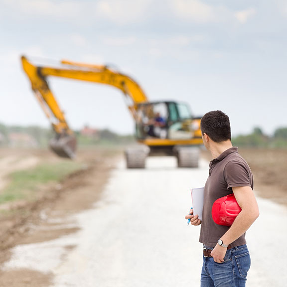 civil engineer standing on a road