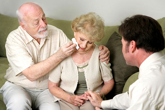 counselor counseling an elderly couple