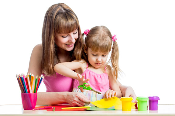 mother and daughter working on craft items