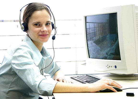 helpdesk woman using a CRT, keyboard, and mouse