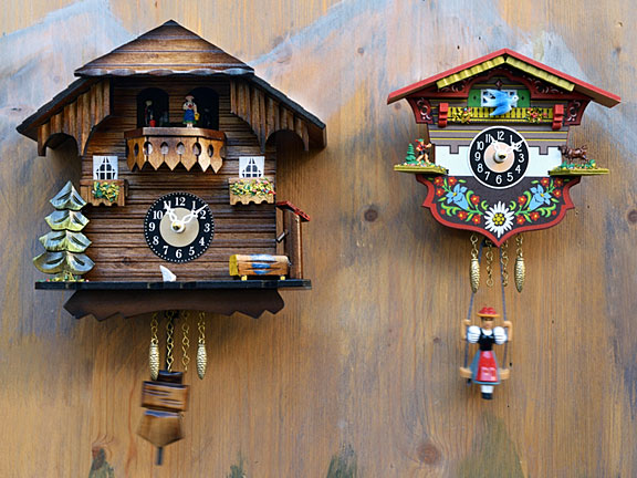 cuckoo clocks on a knotty pine wall