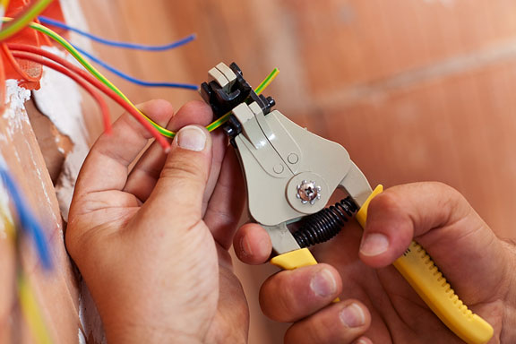 electrician using a wire stripper