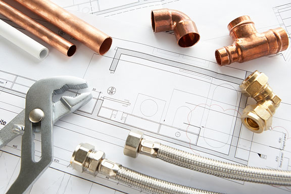 plumbing fittings, tubing, and wrench