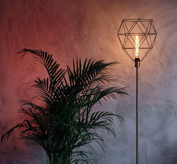 designer floor lamp and greenery