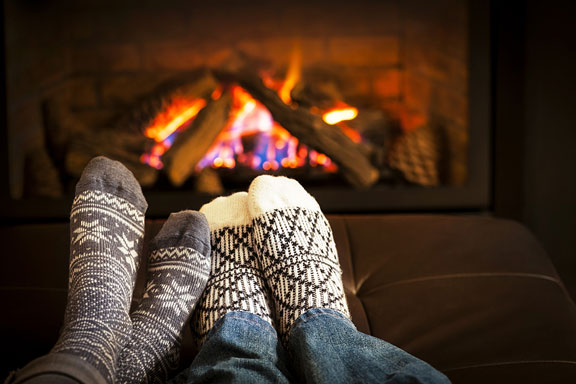 wood fireplace heating a room