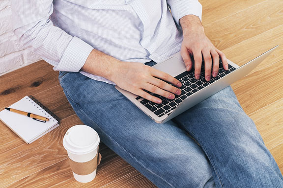 laptop computer on a man's lap