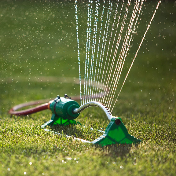 lawn sprinkler watering a lawn