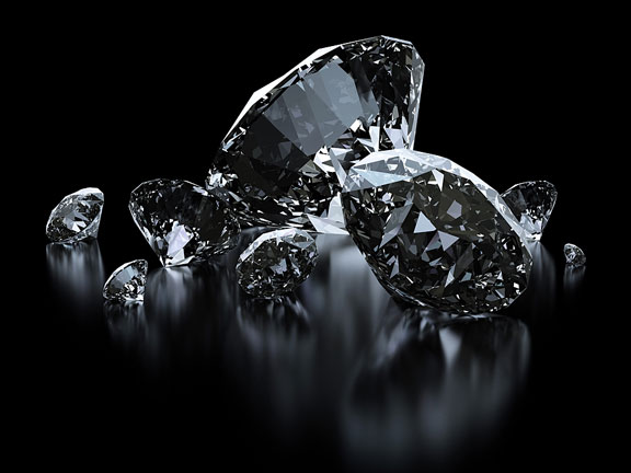 loose diamonds on black background