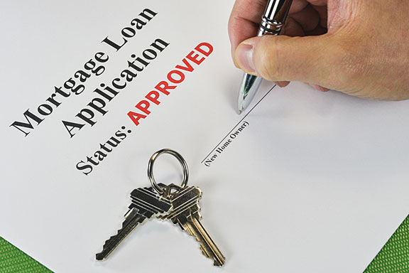 signing an approved mortgage loan