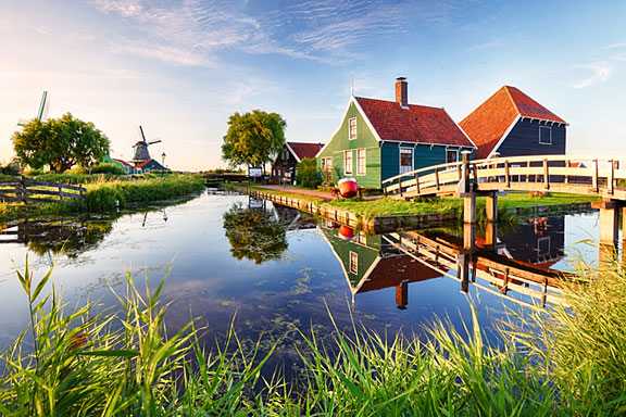 canal and windmill at sunset