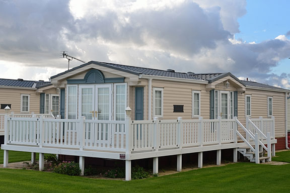 spacious mobile home with raised deck