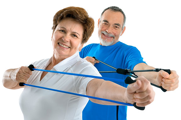 couple exercising with resistance bands