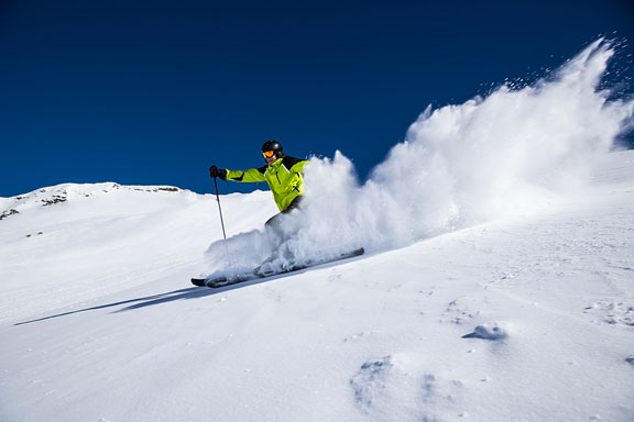 alpine skier skiing downhill