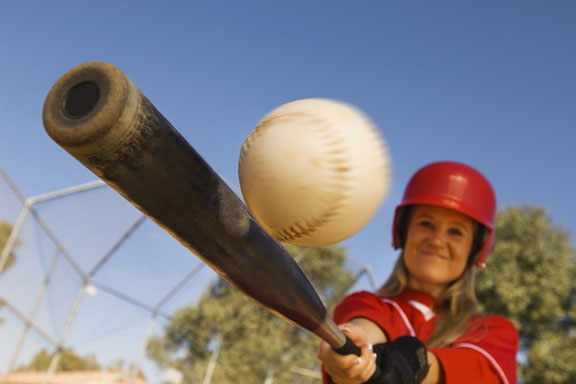 softball player, bat, and softball