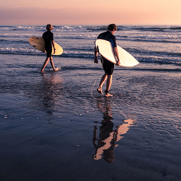 surfers with surfboards