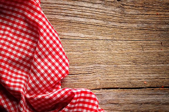 red and white tablecloth on wood