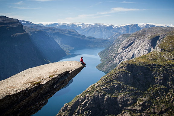 man sitting on Trolltunga, Norway