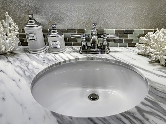 vanity with sink and faucet